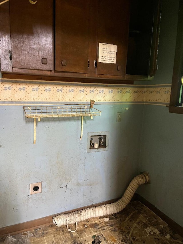 laundry area featuring electric dryer hookup, cabinet space, hookup for a washing machine, and baseboards
