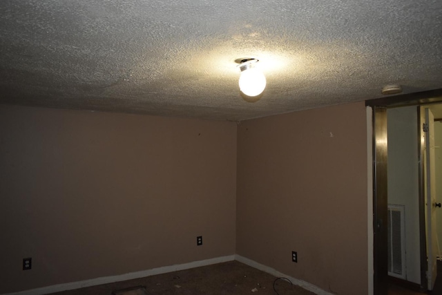 170 Lavenia Cir, Chickamauga, GA 30707 - unfurnished room with a textured ceiling, a smoke detector, and baseboards