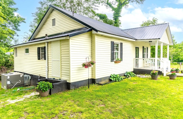 301 Cedar St, Lafayette, GA 30728 - view of side of property with covered porch, a yard, metal roof, and central air condition unit
