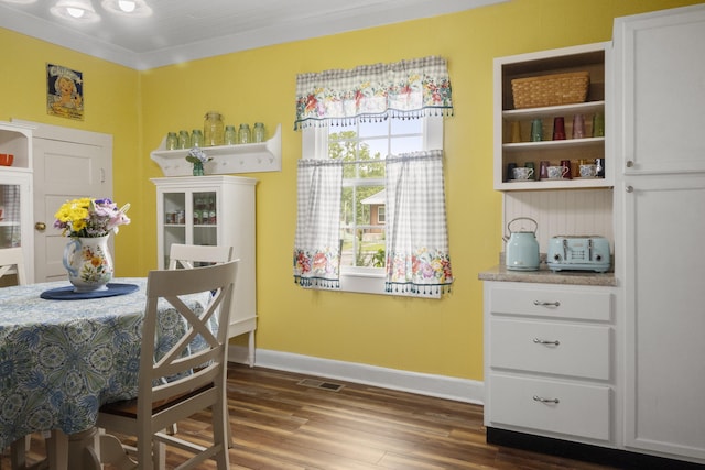 301 Cedar St, Lafayette, GA 30728 - dining area featuring dark wood-style flooring, baseboards, and crown molding