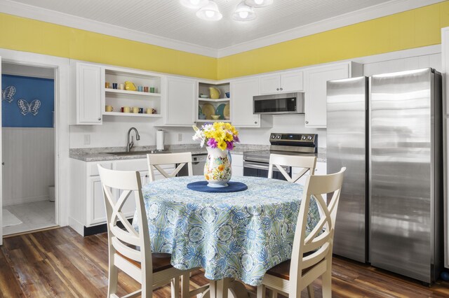 301 Cedar St, Lafayette, GA 30728 - kitchen with stainless steel appliances, open shelves, white cabinets, a chandelier, and ornamental molding