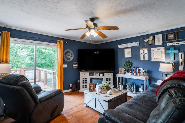 976 Chamberlain Rd, Lafayette, GA 30728 - living area featuring ceiling fan, hardwood / wood-style flooring, baseboards, a textured ceiling, and ornamental molding