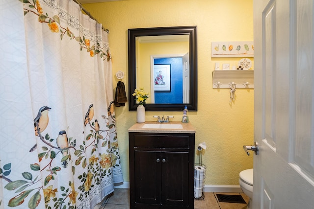 976 Chamberlain Rd, Lafayette, GA 30728 - full bathroom with toilet, vanity, tile patterned flooring, and baseboards