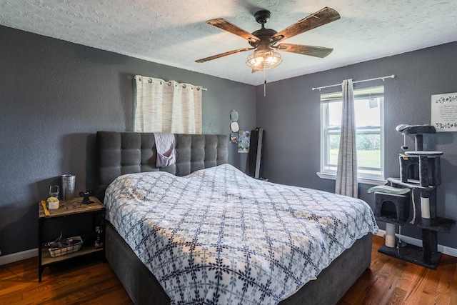 976 Chamberlain Rd, Lafayette, GA 30728 - bedroom featuring wood finished floors, a textured ceiling, a textured wall, baseboards, and a ceiling fan