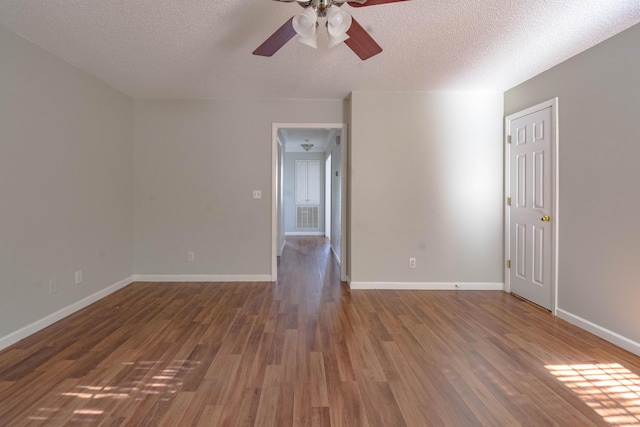 2204 Old Ivy Way Apt 3, Dalton, GA 30720 - empty room featuring a ceiling fan, wood finished floors, baseboards, and a textured ceiling