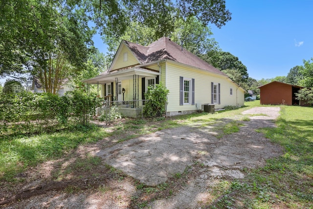 506 Daugherty St, Lafayette, GA 30728 - view of front of house featuring covered porch, central AC, and a chimney