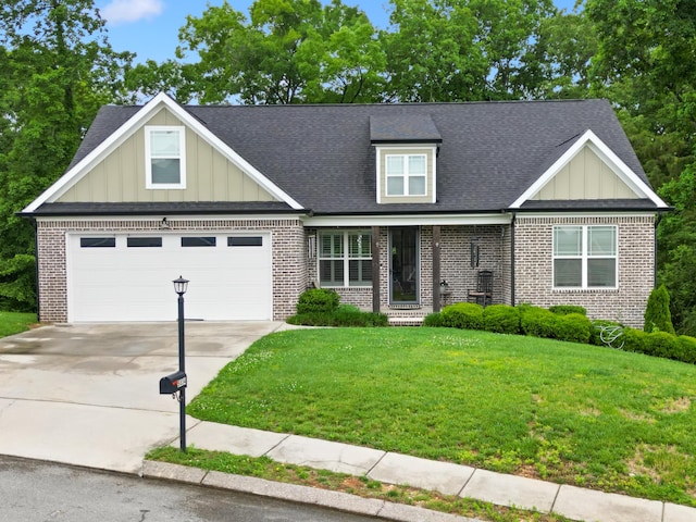 5834 Caney Ridge Cir, Ooltewah, TN 37363 - view of front facade with brick siding, board and batten siding, concrete driveway, and a front lawn