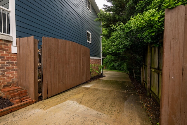 715 Forest Ave, Chattanooga, TN 37405 - view of side of property featuring brick siding, a patio area, and a gate