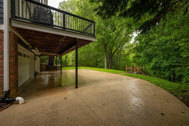 715 Forest Ave, Chattanooga, TN 37405 - view of patio with a garage, concrete driveway, and a deck
