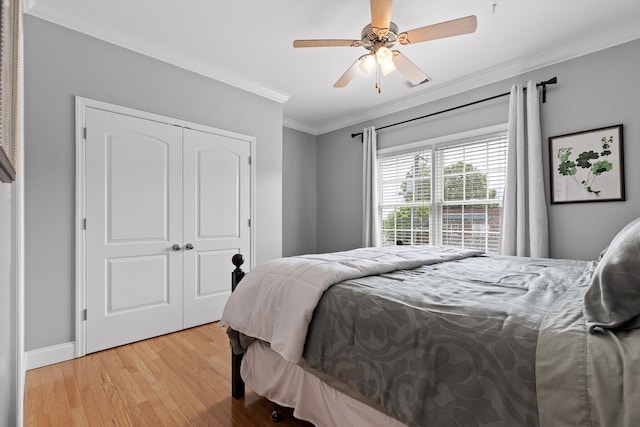 715 Forest Ave, Chattanooga, TN 37405 - bedroom with ornamental molding, light wood-style flooring, a closet, ceiling fan, and baseboards