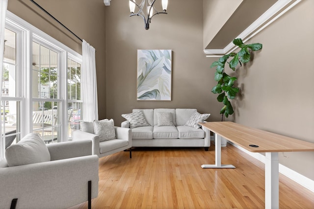715 Forest Ave, Chattanooga, TN 37405 - living area with a chandelier, healthy amount of natural light, and wood finished floors