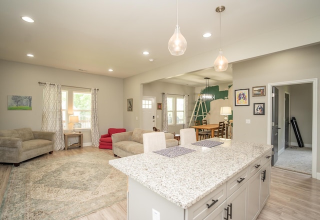 714 W 42nd St, Chattanooga, TN 37410 - kitchen with a center island, open floor plan, light wood-style flooring, baseboards, and recessed lighting