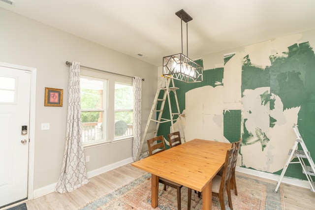 714 W 42nd St, Chattanooga, TN 37410 - dining room featuring wood finished floors, a chandelier, and baseboards