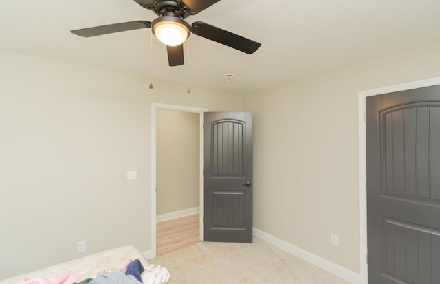 714 W 42nd St, Chattanooga, TN 37410 - unfurnished bedroom featuring light carpet, baseboards, and ceiling fan
