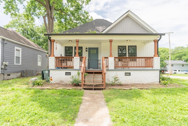 714 W 42nd St, Chattanooga, TN 37410 - view of front of property with a porch, a front lawn, and board and batten siding