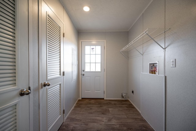 washroom featuring hookup for a washing machine, wood finished floors, and baseboards