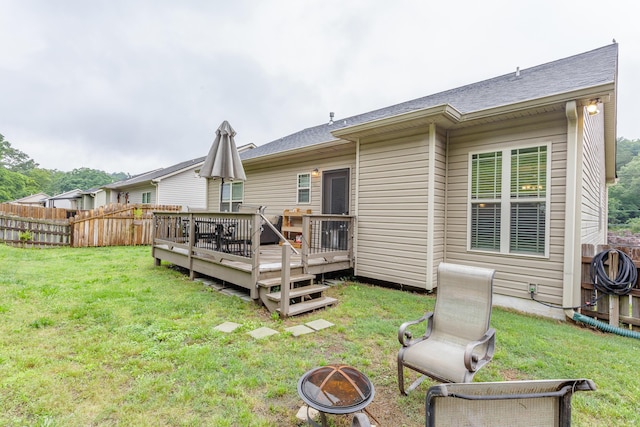 634 Gadd Rd, Hixson, TN 37343 - rear view of house featuring a fire pit, a wooden deck, and roof with shingles