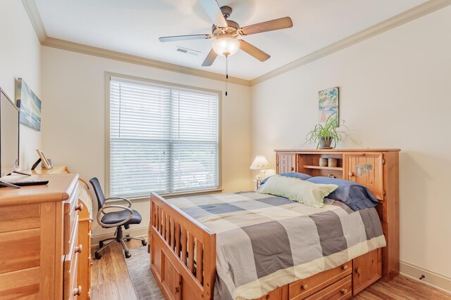 634 Gadd Rd, Hixson, TN 37343 - bedroom featuring light wood-type flooring, baseboards, crown molding, and a ceiling fan