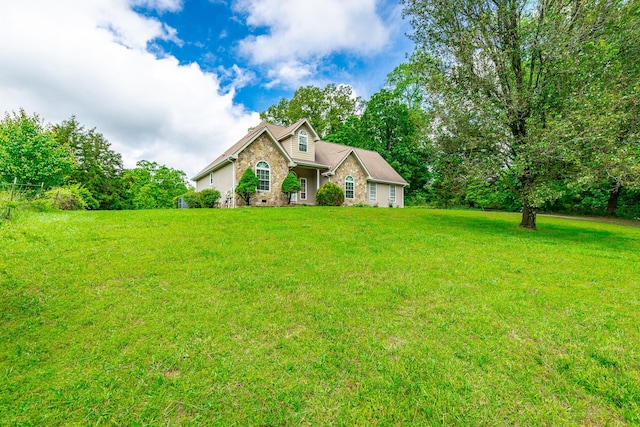 13709 Stormer Rd, Soddy Daisy, TN 37379 - view of front facade with a front yard and brick siding