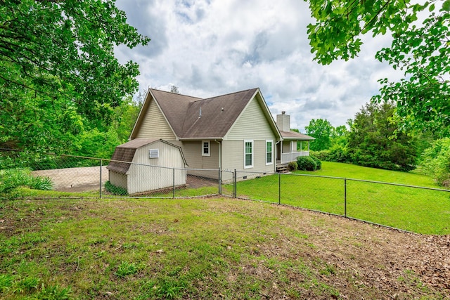 13709 Stormer Rd, Soddy Daisy, TN 37379 - rear view of property with a chimney, a shed, and an outdoor structure