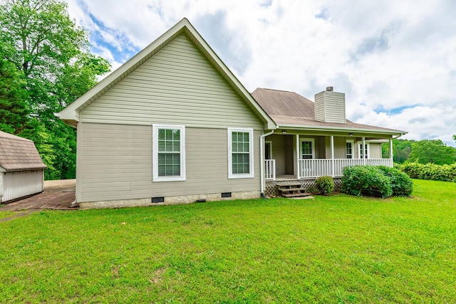 13709 Stormer Rd, Soddy Daisy, TN 37379 - rear view of property featuring covered porch, a chimney, a yard, crawl space, and an outdoor structure