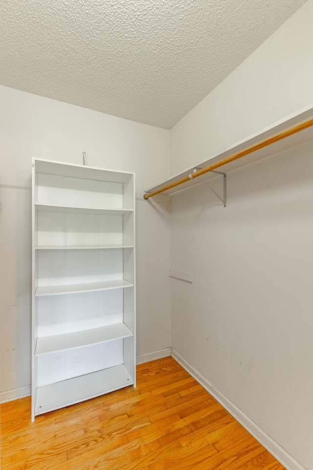 13709 Stormer Rd, Soddy Daisy, TN 37379 - walk in closet featuring wood finished floors