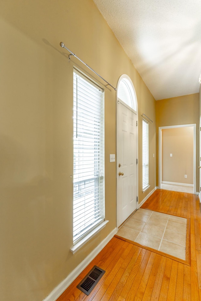 13709 Stormer Rd, Soddy Daisy, TN 37379 - foyer entrance featuring light wood-type flooring and baseboards
