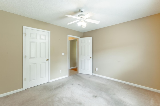 13709 Stormer Rd, Soddy Daisy, TN 37379 - unfurnished bedroom with light colored carpet, baseboards, and a ceiling fan
