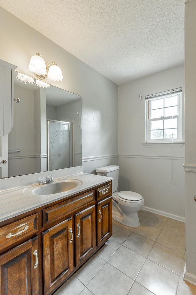 13709 Stormer Rd, Soddy Daisy, TN 37379 - full bathroom featuring vanity, a shower stall, tile patterned floors, a textured ceiling, and toilet