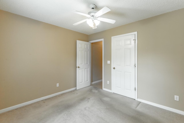 13709 Stormer Rd, Soddy Daisy, TN 37379 - unfurnished bedroom featuring baseboards, light carpet, and a ceiling fan