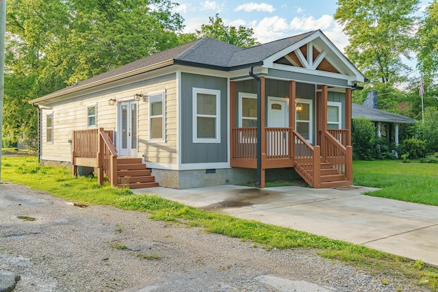 11 Woodvale Ave, Chattanooga, TN 37411 - view of front of home featuring crawl space, french doors, and board and batten siding