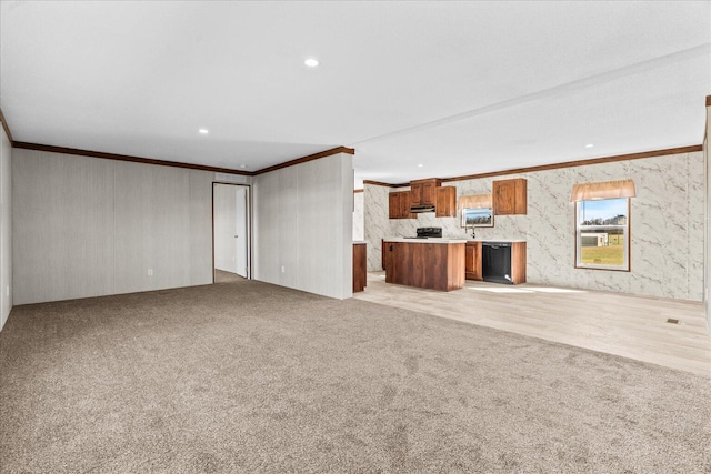 unfurnished living room featuring ornamental molding, light colored carpet, and recessed lighting