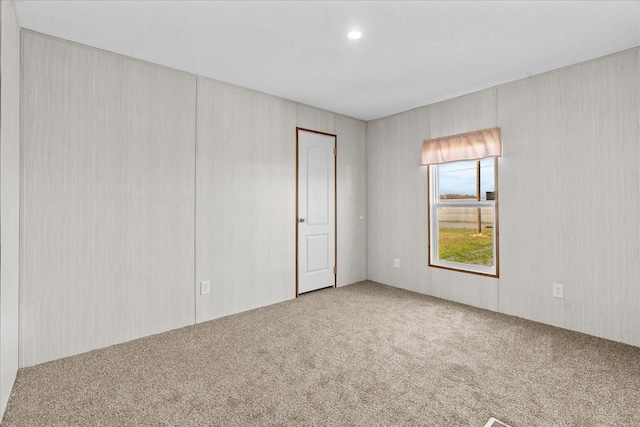 view of carpeted spare room