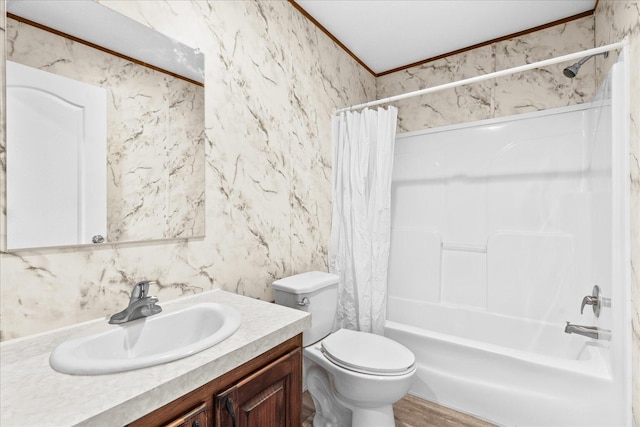 full bath with crown molding, vanity, toilet, and shower / bath combo