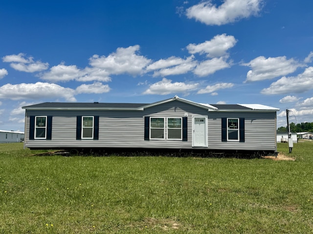 view of property exterior with a lawn
