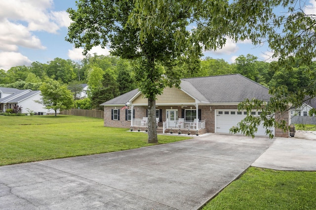 12204 Plow Ln, Soddy Daisy, TN 37379 - ranch-style home featuring a porch, brick siding, concrete driveway, and an attached garage