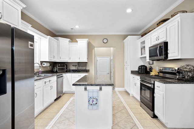 12204 Plow Ln, Soddy Daisy, TN 37379 - kitchen with appliances with stainless steel finishes, a sink, light tile patterned floors, crown molding, and white cabinets
