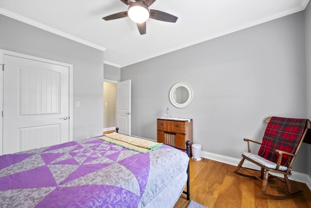 12204 Plow Ln, Soddy Daisy, TN 37379 - bedroom featuring ornamental molding, wood finished floors, baseboards, and a ceiling fan