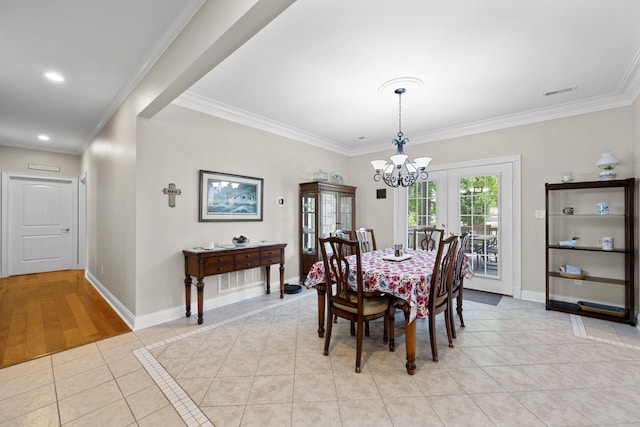 12204 Plow Ln, Soddy Daisy, TN 37379 - dining room featuring french doors, light tile patterned flooring, ornamental molding, a chandelier, and baseboards