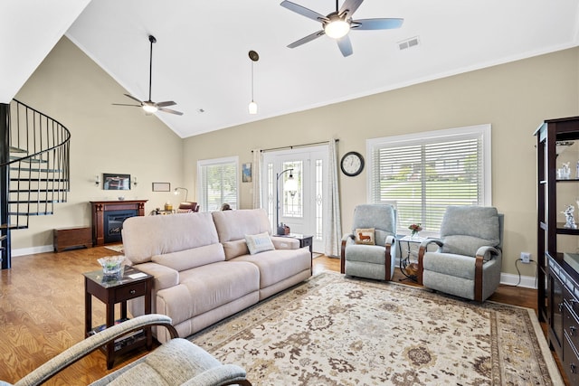 12204 Plow Ln, Soddy Daisy, TN 37379 - living area with ceiling fan, healthy amount of natural light, stairs, crown molding, and high vaulted ceiling