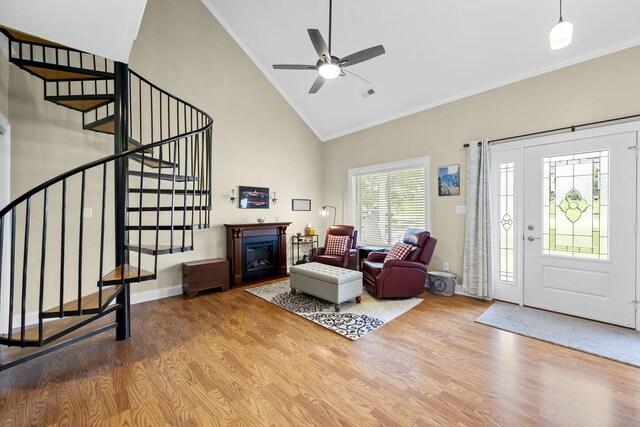 12204 Plow Ln, Soddy Daisy, TN 37379 - foyer featuring crown molding, wood finished floors, stairs, ceiling fan, and high vaulted ceiling