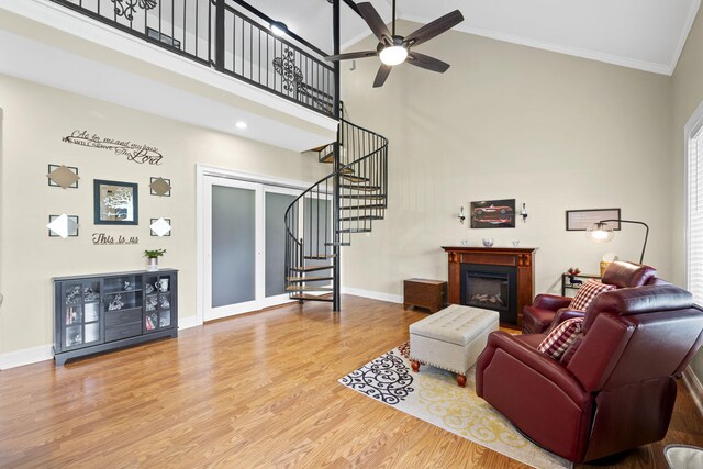 12204 Plow Ln, Soddy Daisy, TN 37379 - living area with a high ceiling, stairway, ceiling fan, a fireplace, and baseboards