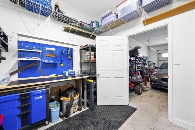 12204 Plow Ln, Soddy Daisy, TN 37379 - garage featuring a workshop area