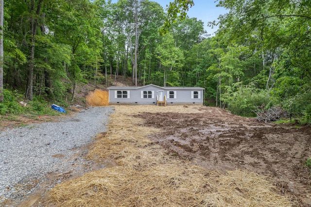 398 Jodie Ln, Dayton, TN 37321 - manufactured / mobile home featuring entry steps, a forest view, and crawl space