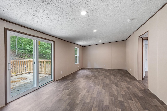 398 Jodie Ln, Dayton, TN 37321 - empty room with wood finished floors, a textured ceiling, and recessed lighting