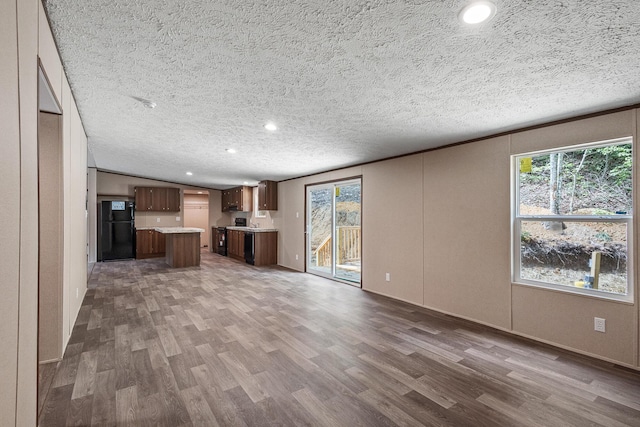 398 Jodie Ln, Dayton, TN 37321 - unfurnished living room featuring wood finished floors, recessed lighting, and a textured ceiling