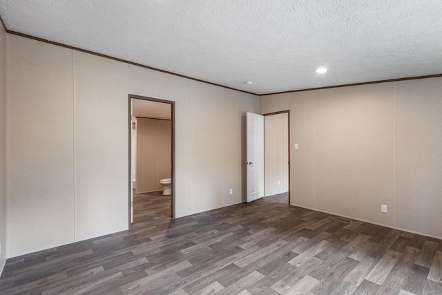 398 Jodie Ln, Dayton, TN 37321 - unfurnished bedroom with wood finished floors, a textured ceiling, crown molding, a decorative wall, and ensuite bathroom