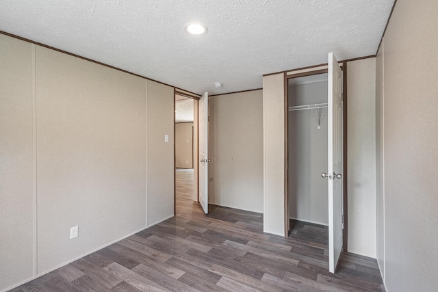 398 Jodie Ln, Dayton, TN 37321 - unfurnished bedroom with a textured ceiling and wood finished floors