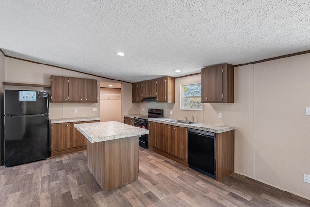 398 Jodie Ln, Dayton, TN 37321 - kitchen featuring black appliances, wood finished floors, light countertops, a textured ceiling, and recessed lighting