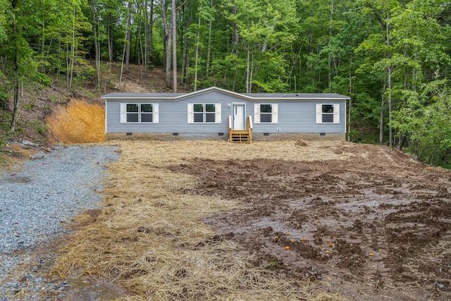 398 Jodie Ln, Dayton, TN 37321 - manufactured / mobile home featuring crawl space, a forest view, and entry steps